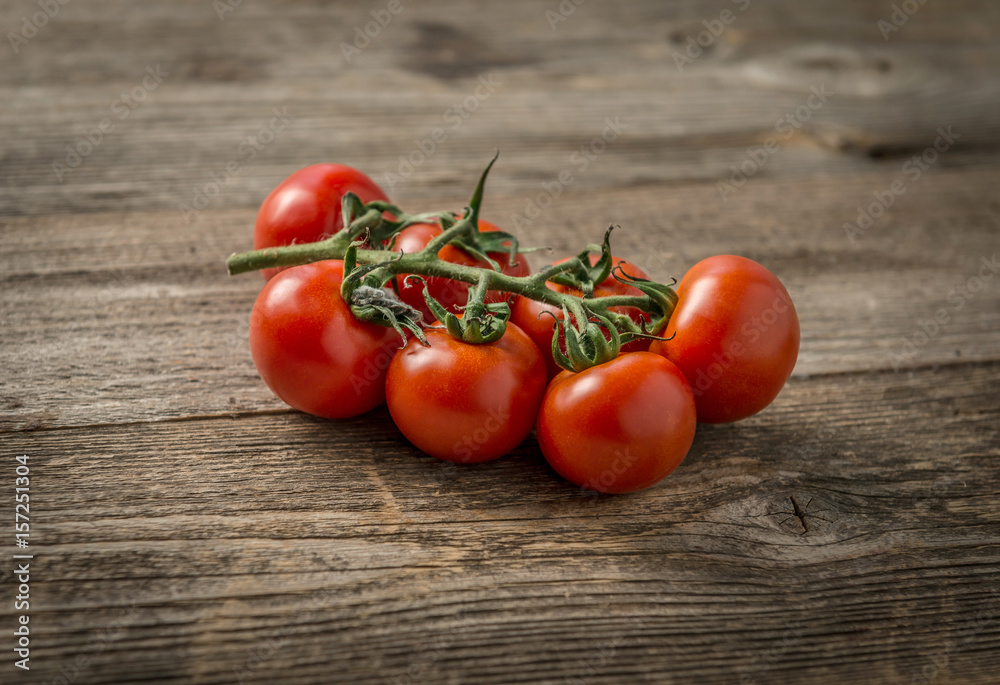 Red ripe tomatoes connected to each other Red ripe tomatoes connected to each other