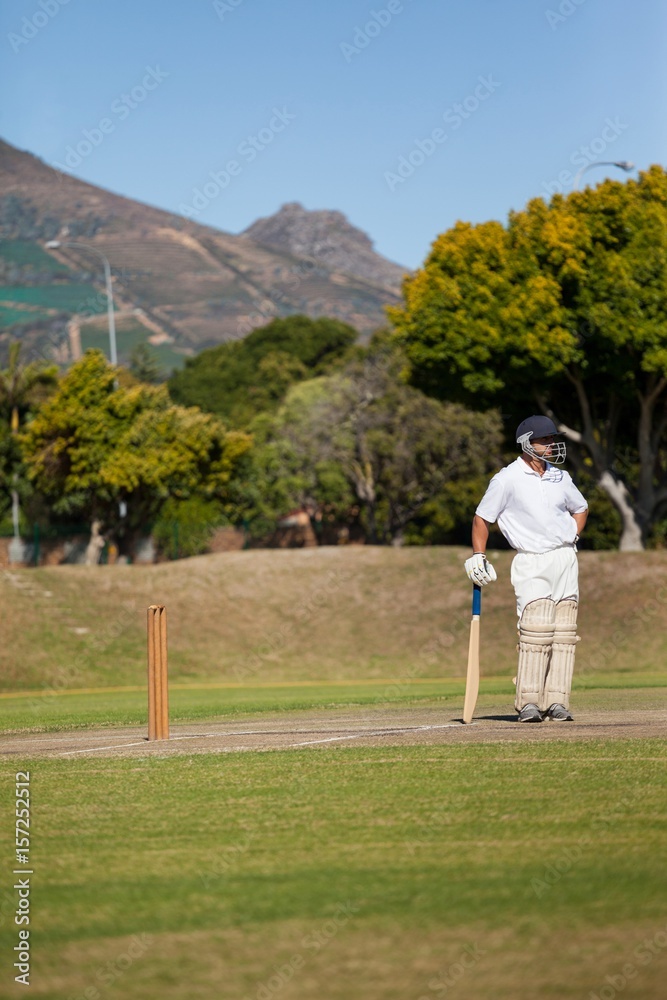 Fototapeta premium Full length of batsman standing on field during match