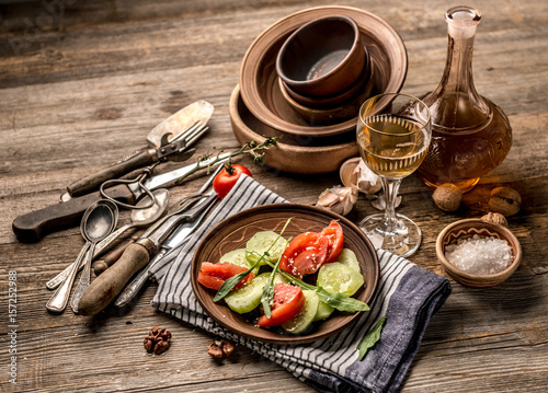Simple salad of cucumers and tomatoes, rustic dishes photo