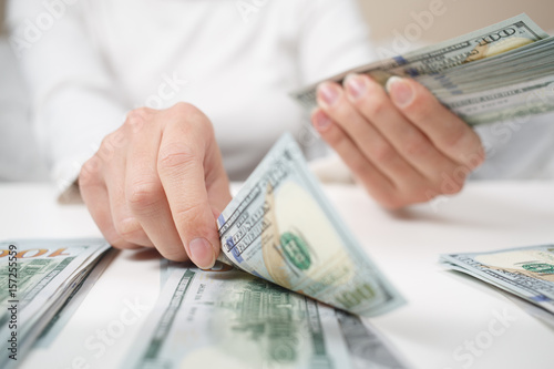 View of woman hands counting money.