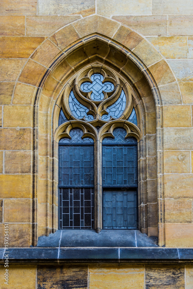 The window in the Gothic style on the south facade of the Cathedral .  Gothic Cathedral of Saints Vitus .Area of the Old Town of Prague, Czech Republic.
