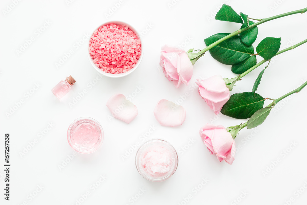 rose organic cosmetics with salt, cream and oil on white table background top view mock up
