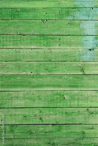 Ancient wood with cracked paint of green color