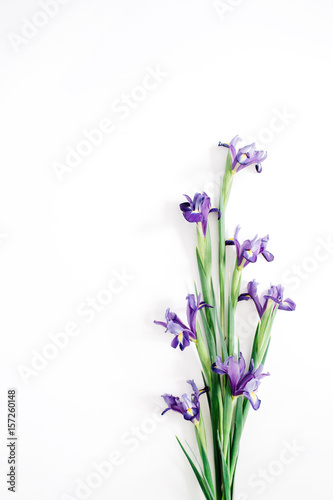 Fototapeta Naklejka Na Ścianę i Meble -  Beautiful purple iris flowers bouquet on white background. Flat lay, top view