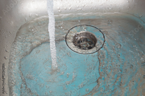the sink pours water flow.
