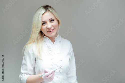 Portrait of modern dentist woman at work.