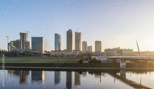 Vilnius business center buildings behind the river on an early morning