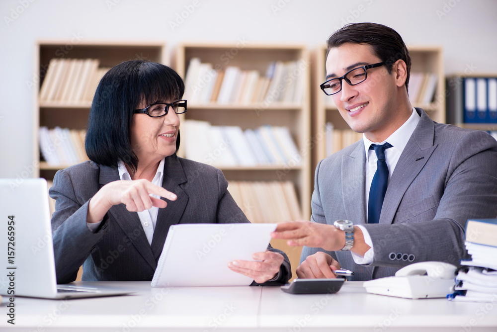 Business couple having discussion in the office Business couple having discussion in the office