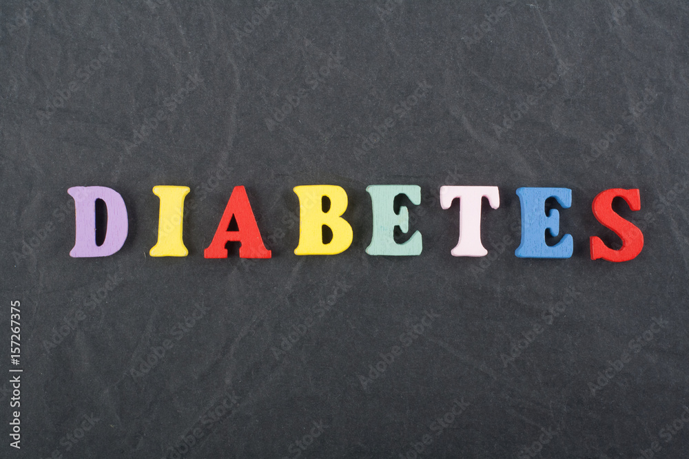 DIABETETES word on black board background composed from colorful abc alphabet block wooden letters, copy space for ad text. Learning english concept. DIABETETES word on black board background composed from colorful abc alphabet block wooden letters, copy space for ad text. Learning english concept.