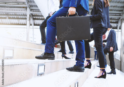 Group of business people walking up stair on city street, go forward concepts.