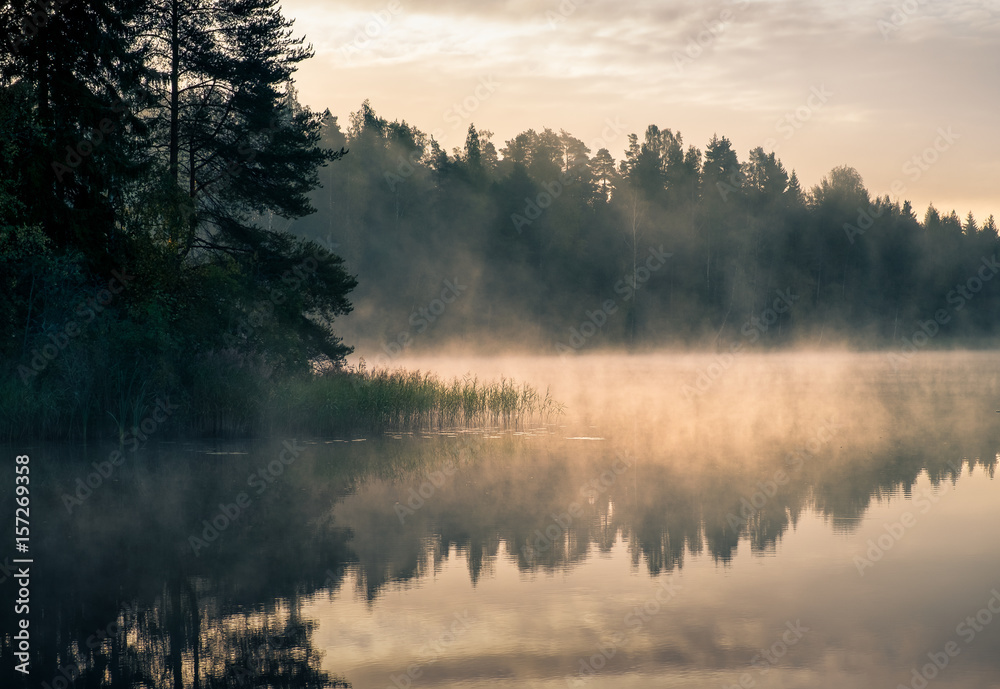 Scenic landscape with lake and sunrise at morning in Finland