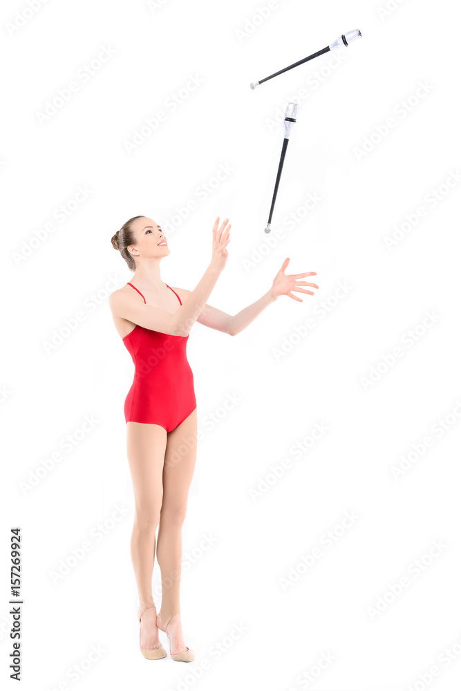 fit rhythmic gymnast training with clubs isolated on white fit rhythmic gymnast training with clubs isolated on white