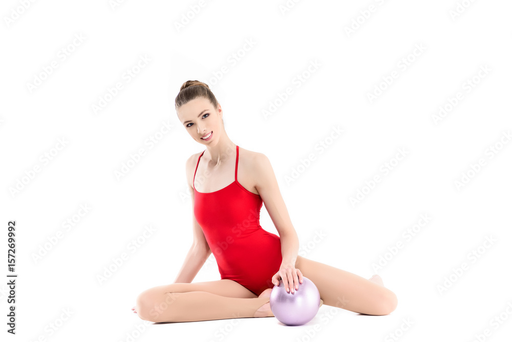 cheerful rhythmic gymnast exercising with ball isolated on white cheerful rhythmic gymnast exercising with ball isolated on white