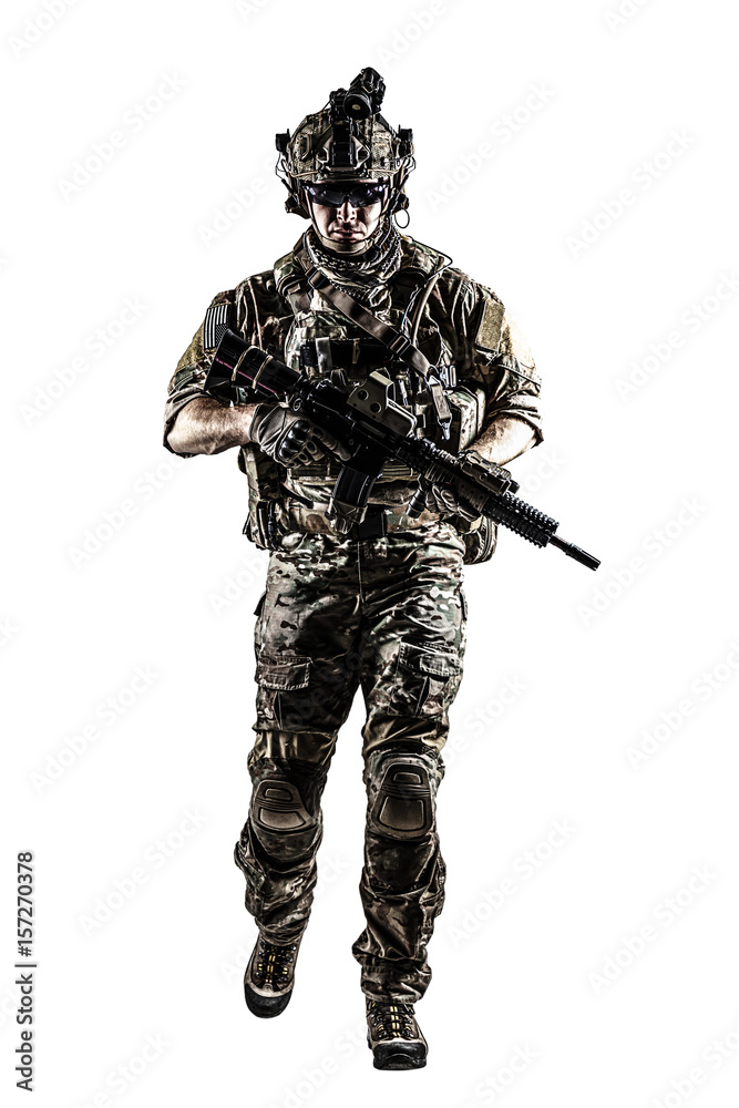 US Army rangers in combat uniforms with his shirt sleeves rolled up, in helmet, eyewear and night vision goggles moving walking towards camera. Studio shot, white background, dark contrast US Army rangers in combat uniforms with his shirt sleeves rolled up, in helmet, eyewear and night vision goggles moving walking towards camera. Studio shot, white background, dark contrast