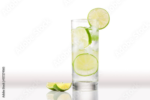 Full glass of water with lemon and mint isolated on white background