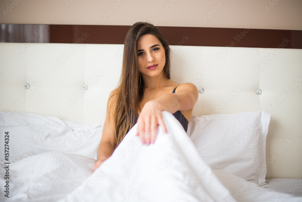Woman lying in her bed after wake up in the morning at home Woman lying in her bed after wake up in the morning at home