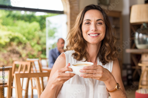 Fotografie Mature woman at cafeteria