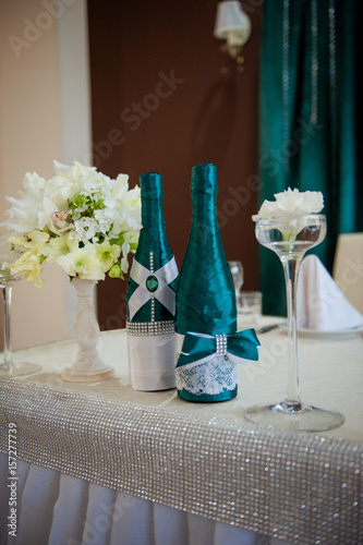 Festive table setting in the restaurant with flowers. Wedding decor.
