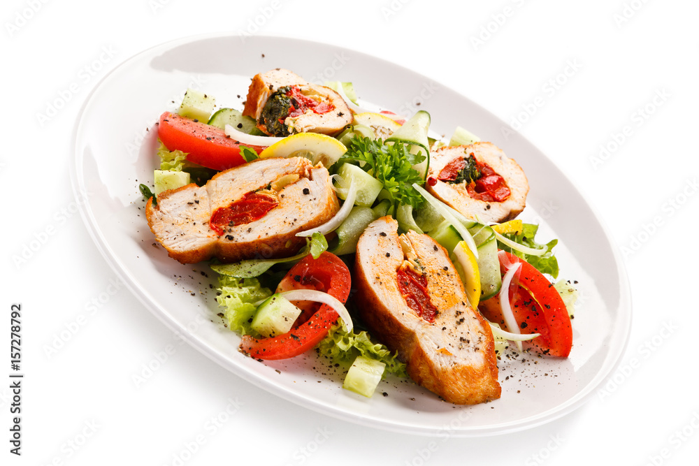 Salad with stuffed chicken fillet on white background Salad with stuffed chicken fillet on white background