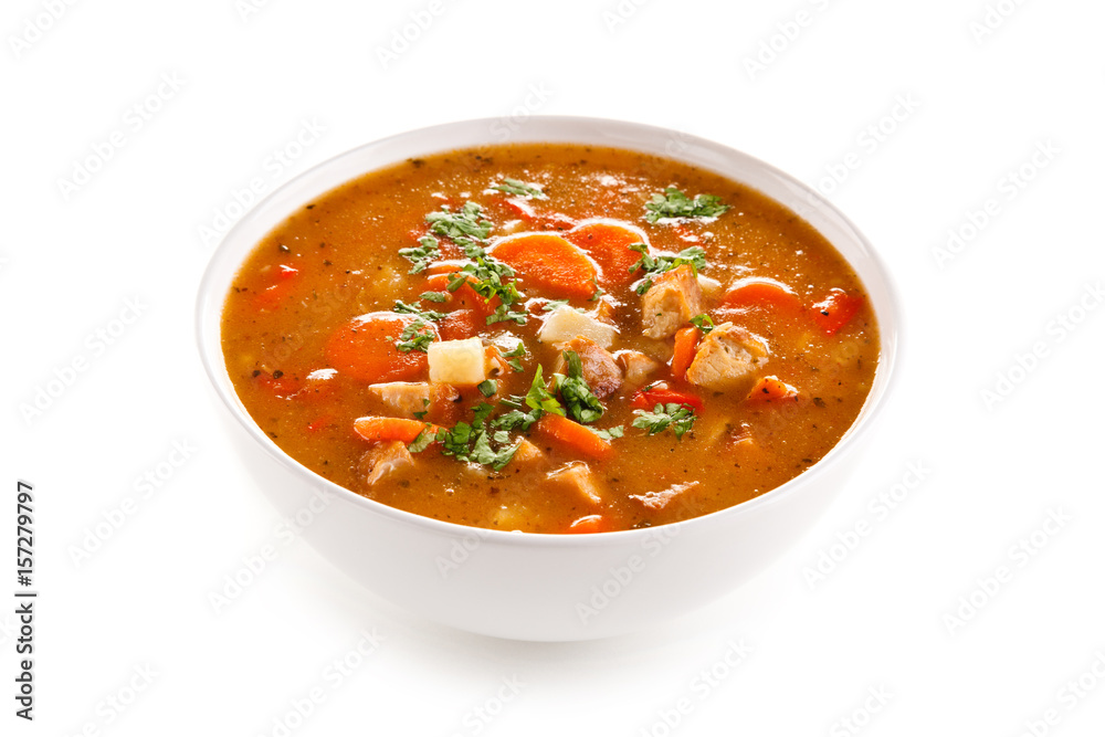 Tomato soup with carrot and chicken on white background