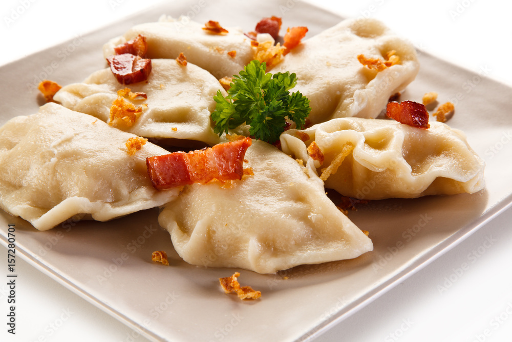 Dumplings - stuffed noodles on white background Dumplings - stuffed noodles on white background