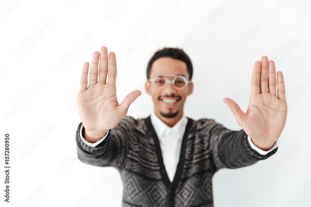 Young african man showing hands. Young african man showing hands.