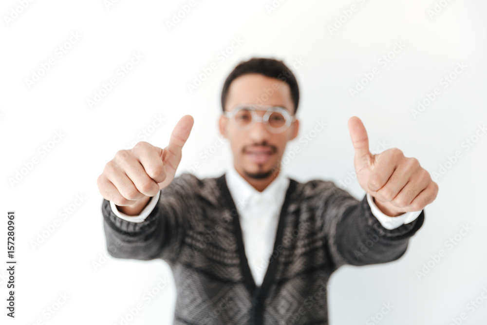 African man showing thumbs up. Focus on hands. African man showing thumbs up. Focus on hands.