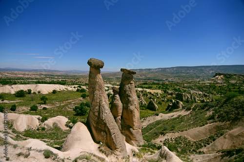Three Graces, three Beautifuls (uc guzeller) rock hills in Devrent valley, Cappadocia, Nevsehir, Turkey