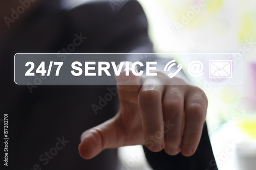 Businessman pressing button 24 hours service modern technology panel
