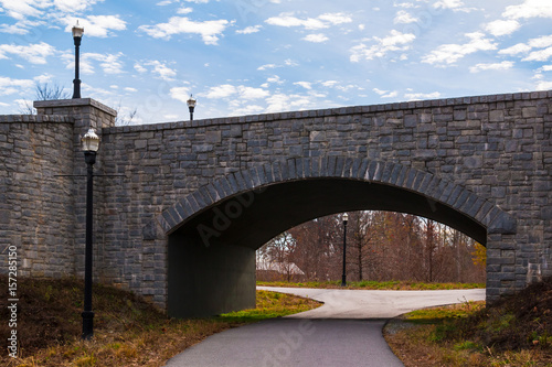 The Piedmont Park Trail and the stone bridge on the Evelyn St NE in autumn day, Atlanta, USA.