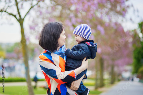 Happy family of two in Paris on a spring day