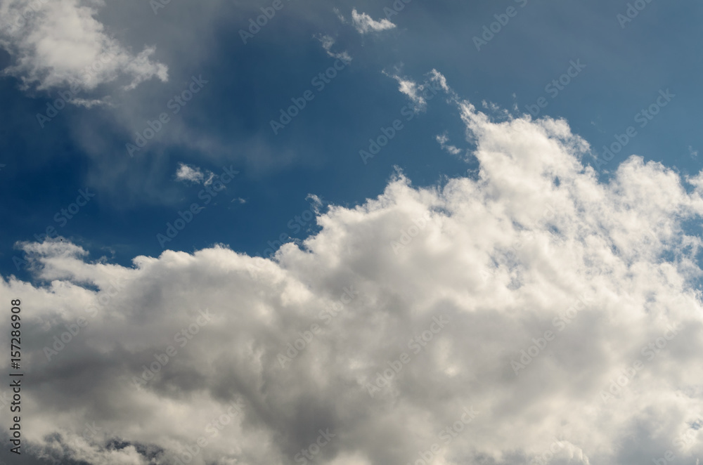 White fluffy clouds in the blue sky. White fluffy clouds in the blue sky.