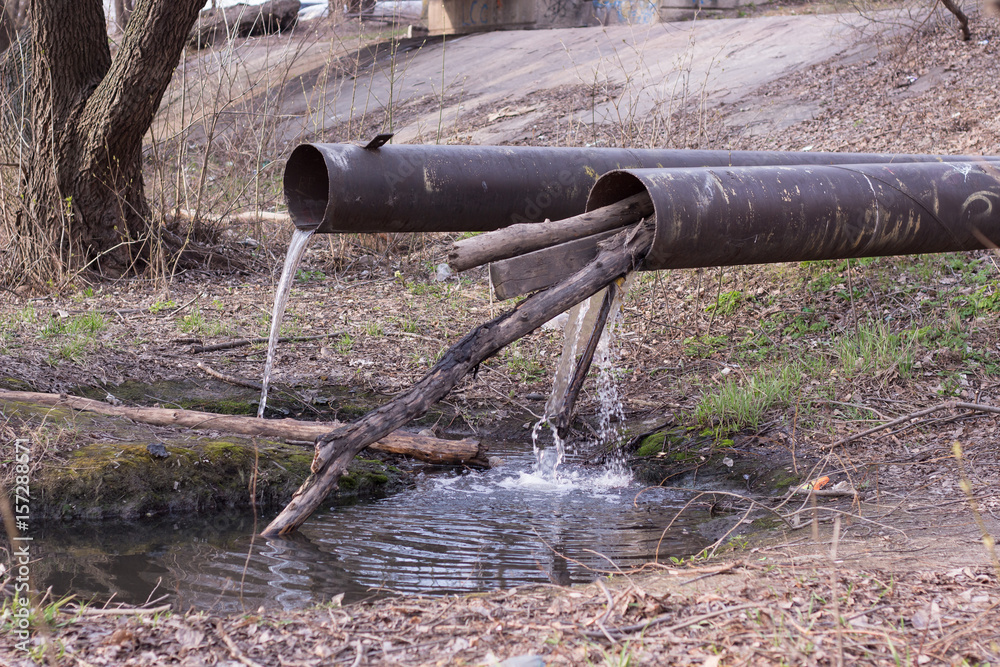 pipes pouring mud water pollution Stock-Foto | Adobe Stock