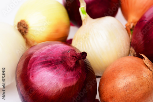 Blend of red, yellow and white sweet onions making pattern