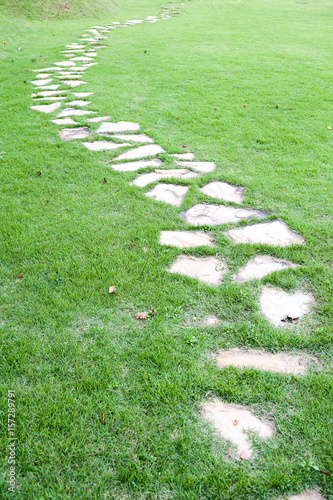 Stone path on green grass