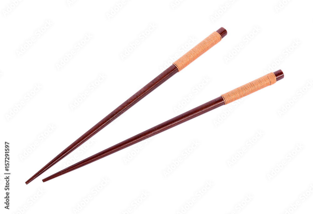 Wooden pairs of chopsticks on white background