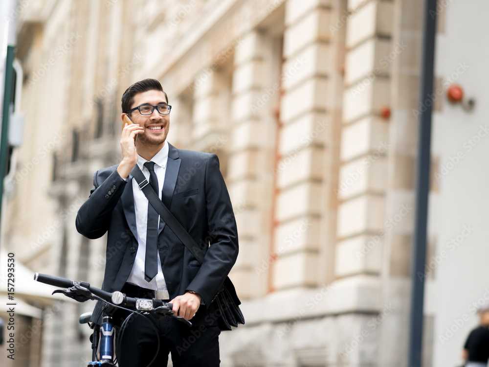Young businessmen with a bike
