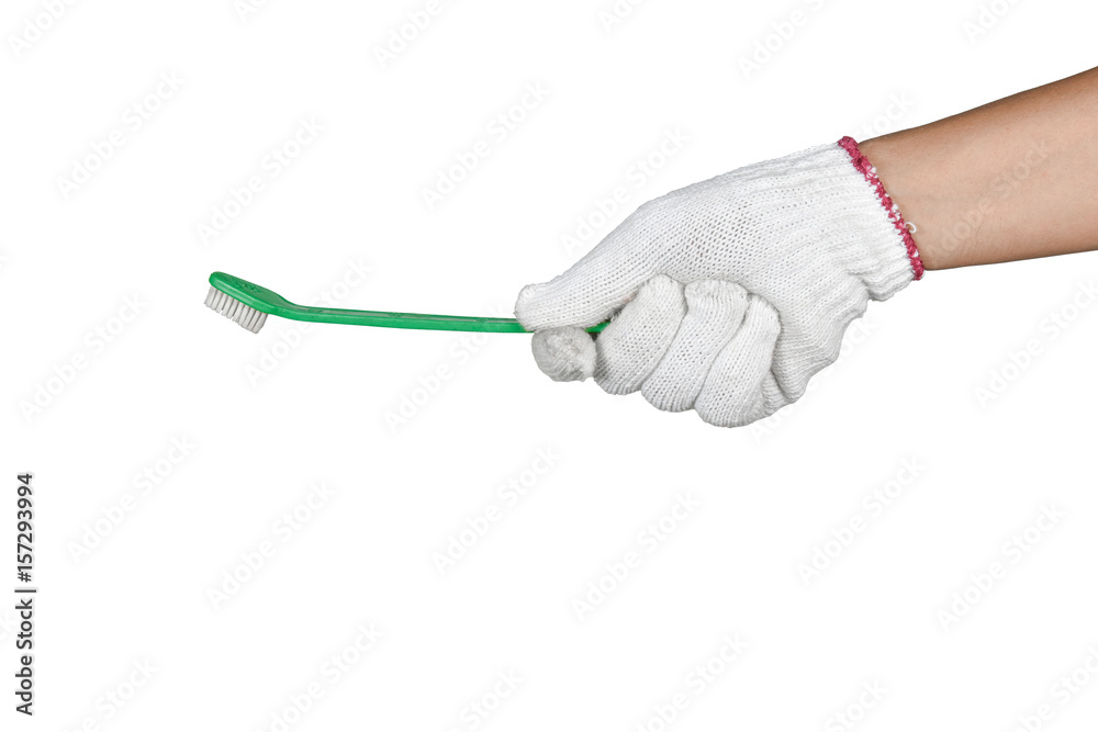 a hand with protection glove holding cleaning brush a hand with protection glove holding cleaning brush