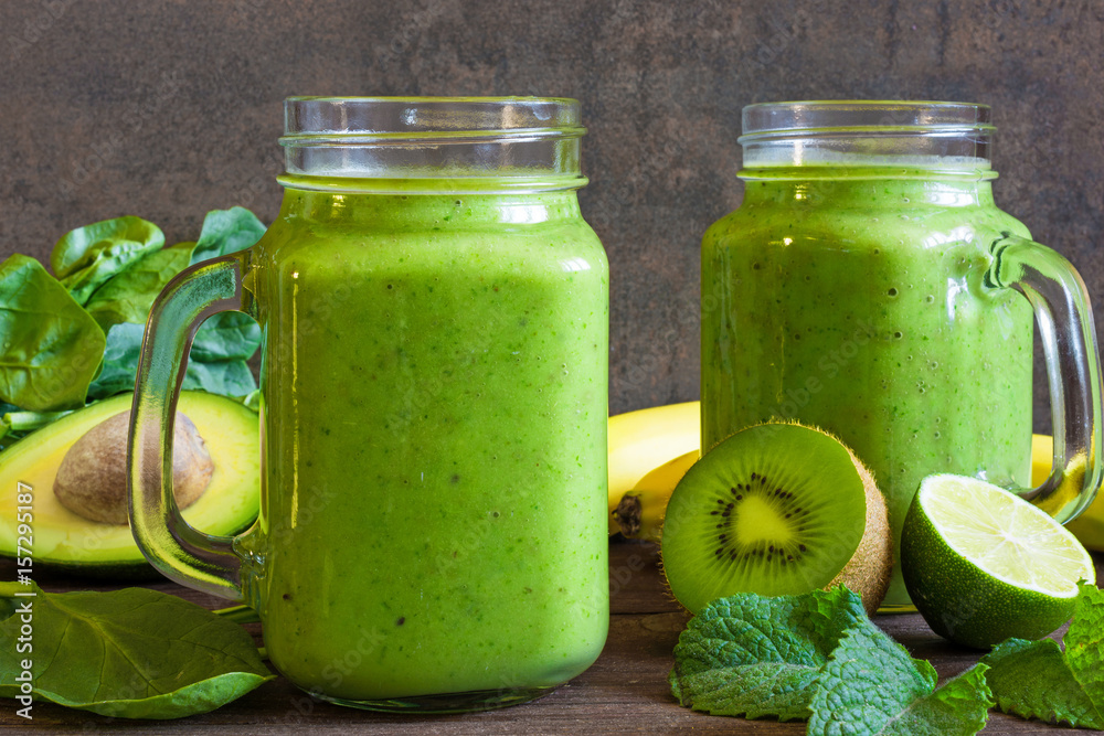healthy drink. green smoothie with banana, spinach, avocado, kiwi, mint and chia seeds healthy drink. green smoothie with banana, spinach, avocado, kiwi, mint and chia seeds