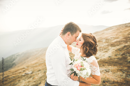 Sensual portrait of a young wedding couple. Outdoor © olegparylyak