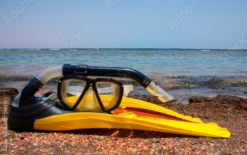 Snorkeling mask and fins on the beach