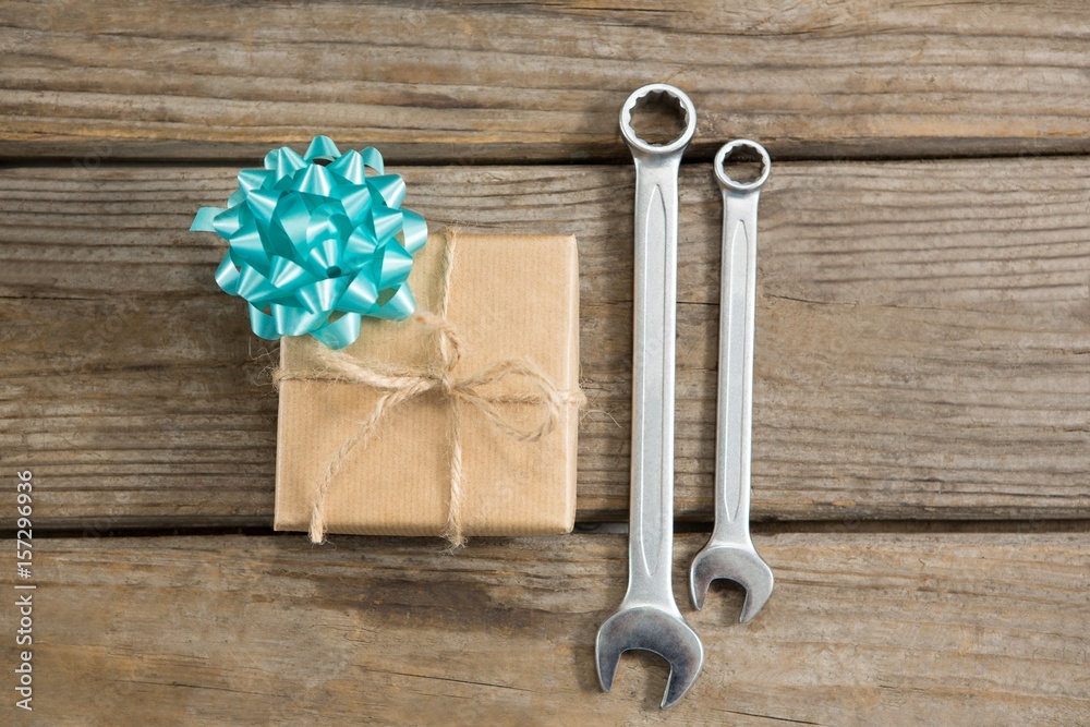 Overhead view of gift by wrench