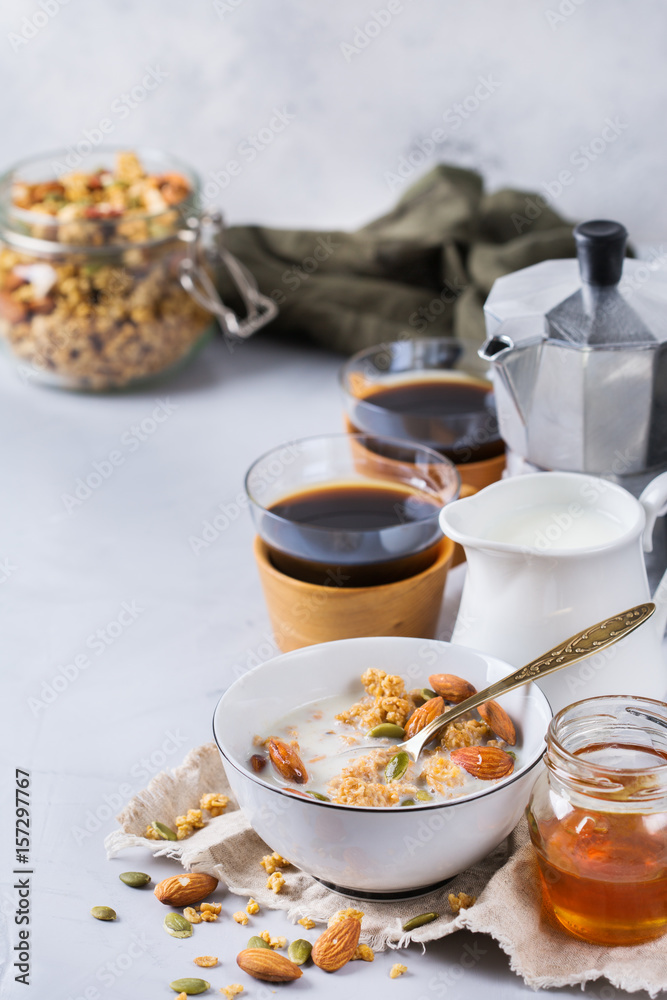 Breakfast with black coffee muesli granola honey nuts milk Breakfast with black coffee muesli granola honey nuts milk