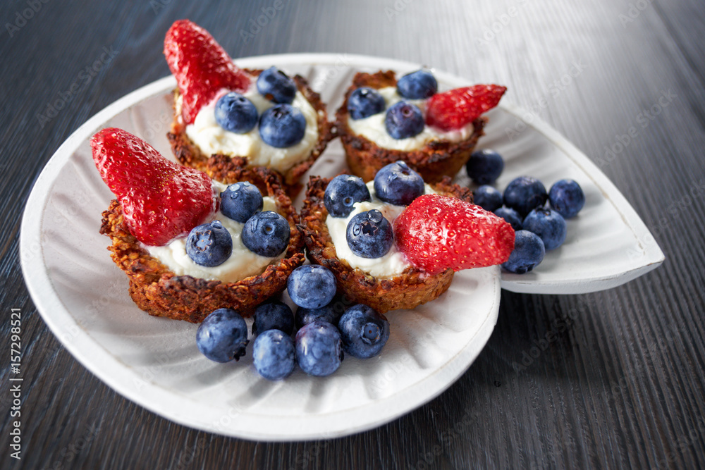 Mascarpone cookie with blueberry and strawberry on a plate Mascarpone cookie with blueberry and strawberry on a plate