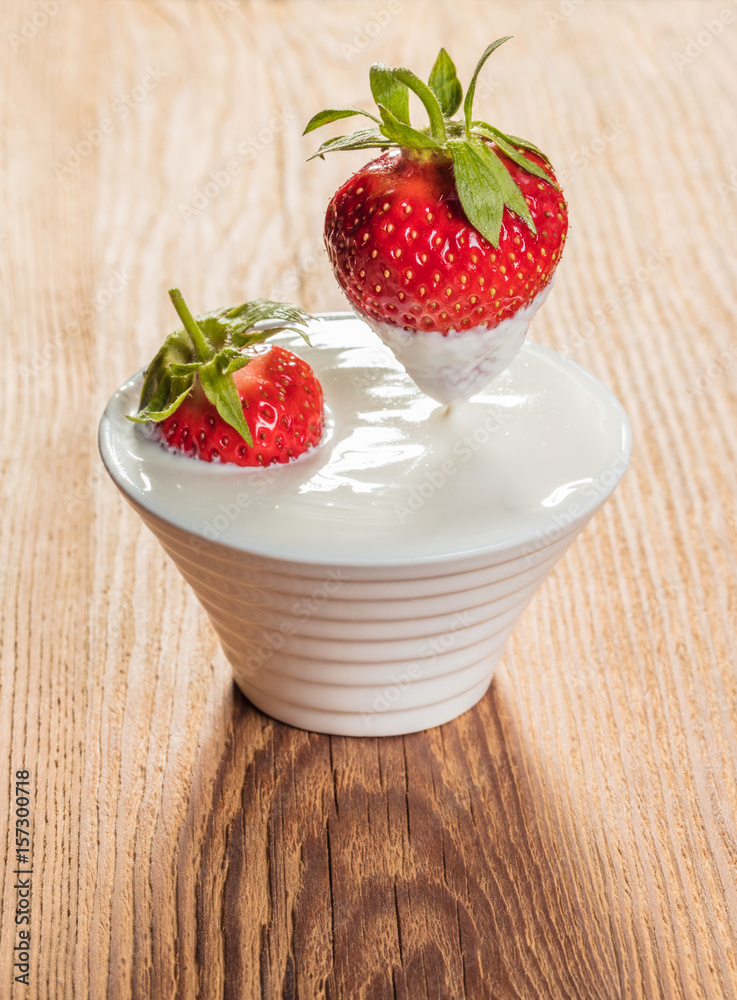 bowl with sour cream and strawberries bowl with sour cream and strawberries
