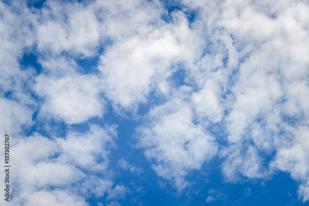 Deep blue sky texture background with white clouds and copy space. Deep blue sky texture background with white clouds and copy space.