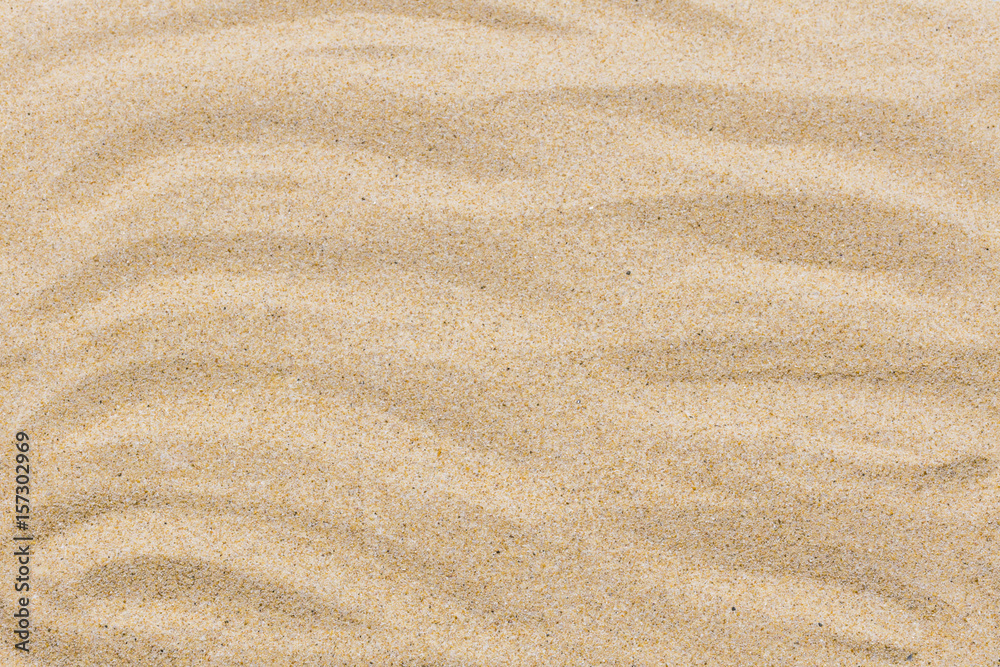 closeup of sand pattern of a beach in the summer for background closeup of sand pattern of a beach in the summer for background