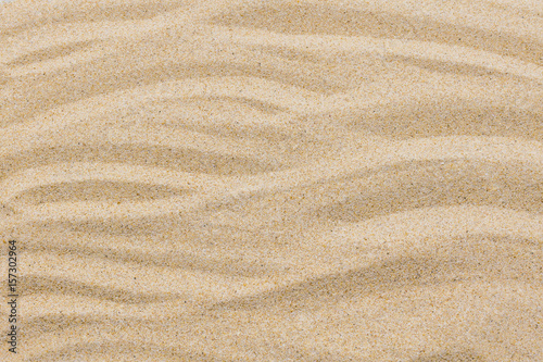 closeup of sand pattern of a beach in the summer for background