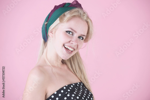 girl smiling with hairband on long, blond hair