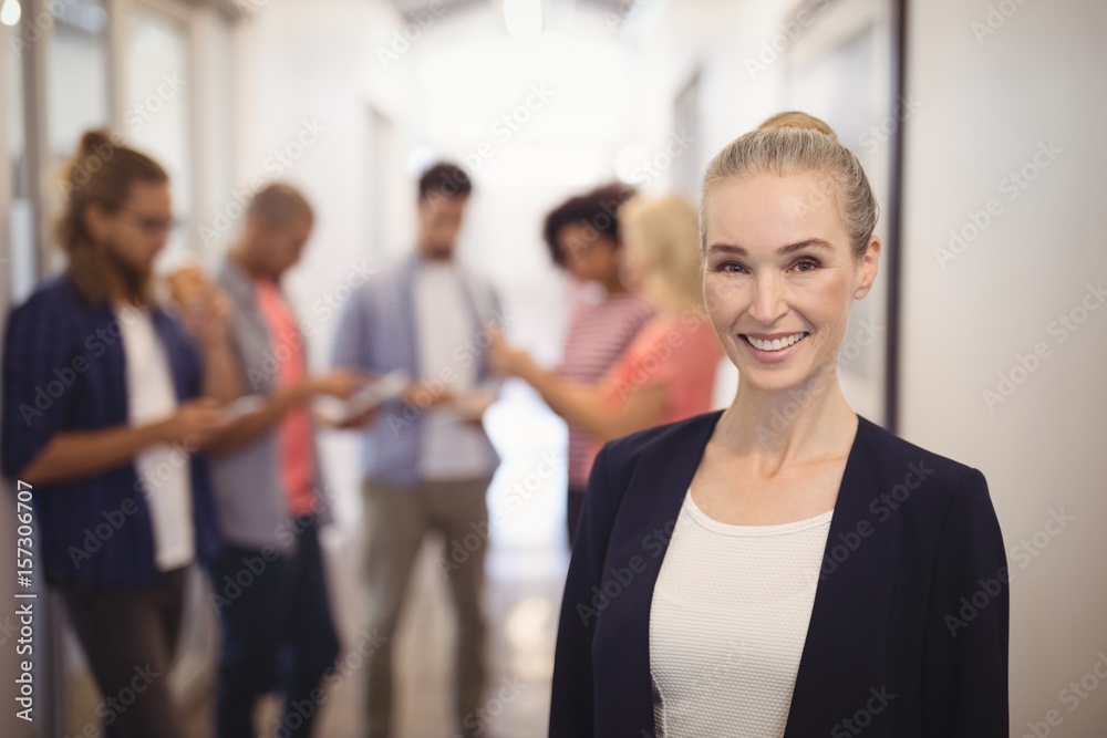 Portrait of smiling businesswoman standing Portrait of smiling businesswoman standing